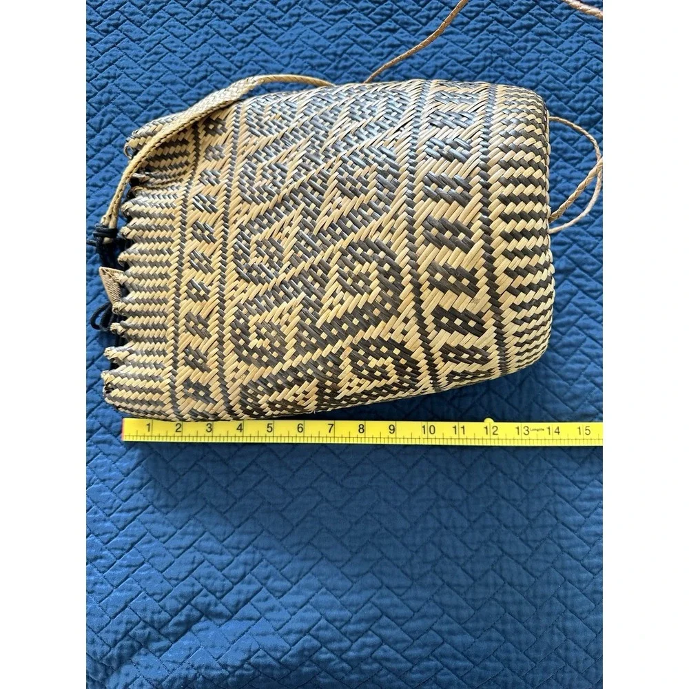 Natural‎ Rattan Backpack featuring a dayak tribal-inspired.